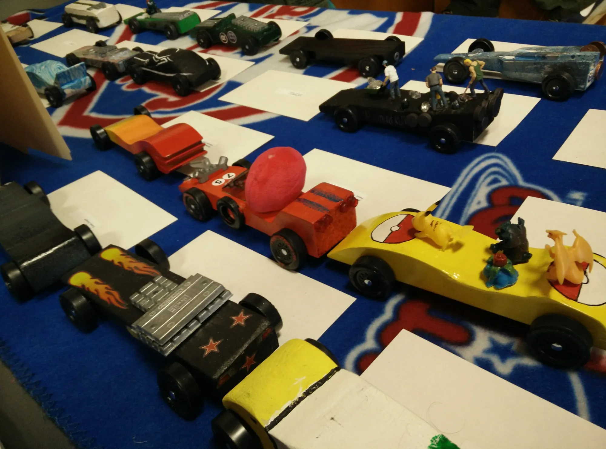 Pinewood Derby cars lined up for race day